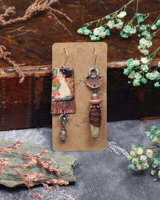 Woman in gold mismatched earrings